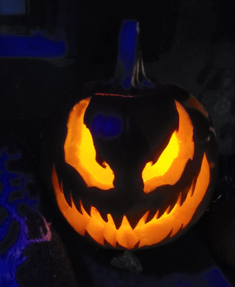 Pumpkin carved to look like Venom's face