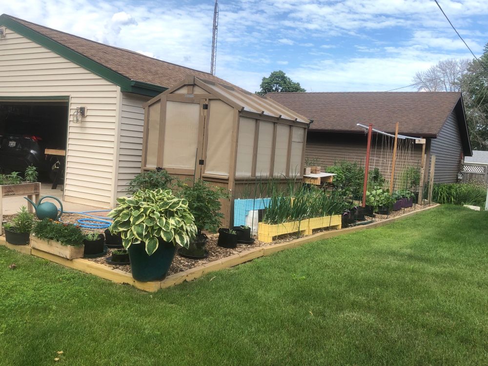 Green house garden on south side of the house. Full sun exposure 8am - 5/6pm.