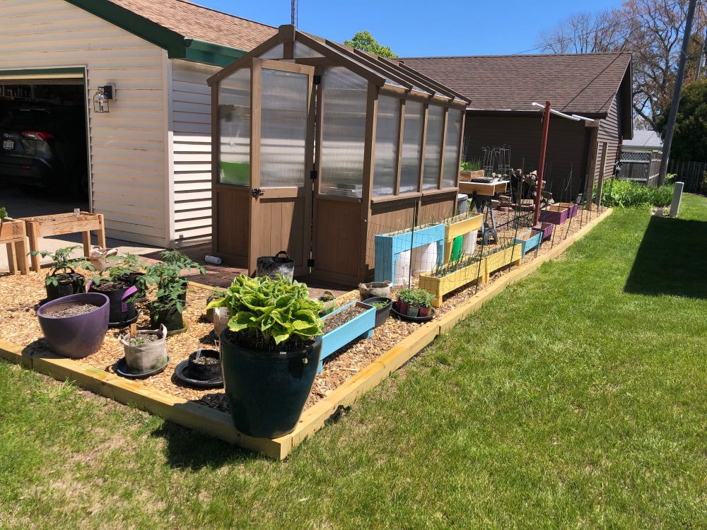 Northwest view of greenhouse and new garden areas.
