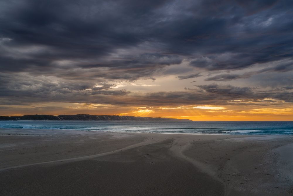 Stormy clouds over the sunrise and ocean