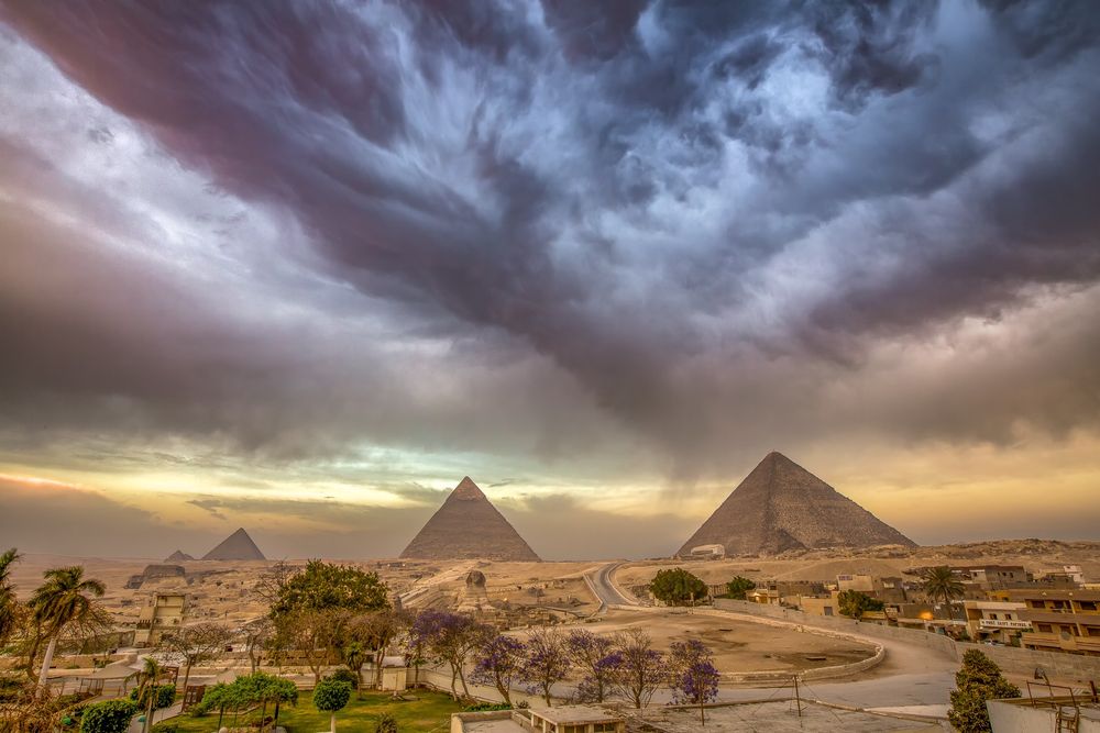 A throwback to photographing a storm rolling in over the Great Pyramids of Egypt at sunrise.