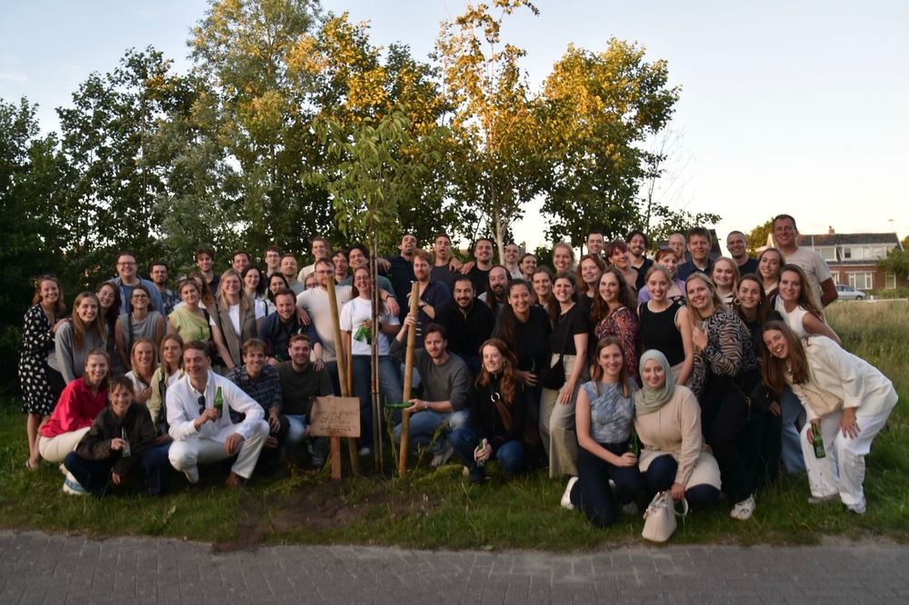 My graduating class, 10 years after finishing high school, standing by a tree we once gifted to the school, now replanted.