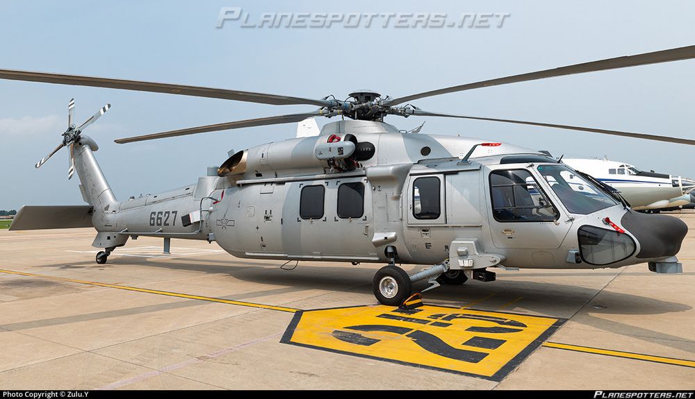 A grey painted Harbin Z-20 that’s a copy of the civilian version of the UH-60. It has a low visibility PLAAF markings on it.