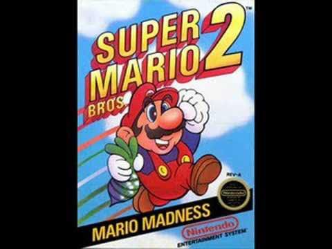 A picture of the cover of Super Mario Brothers Two. At the top is the title in 3d letters; below that is Mario jumping into the sky holding a radish; below that is a black diagonal banner with the words "Mario Madness", the Nintendo seal of Authenticity, and finally below that the Nintendo Entertainment System logo.