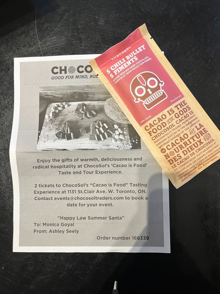 Picture of chocolate gift tasting receipt and chocolate bar.