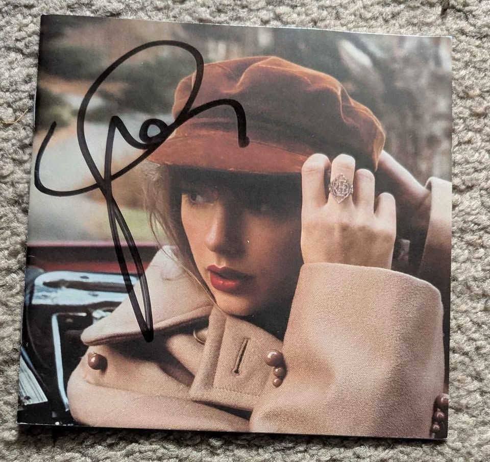 A CD Booklet of Red Taylor's Version, signed by Taylor Swift