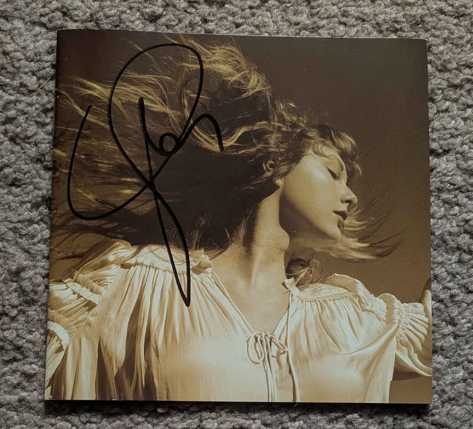A CD Booklet of Fearless Taylor's Version, signed by Taylor Swift