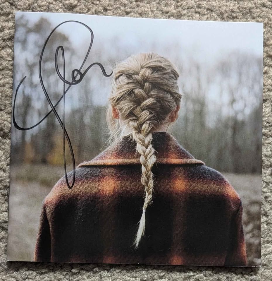 A CD Booklet of Taylor Swift's Evermore, signed by Taylor Swift