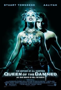 Movie poster of Queen of the Damned. I.age shows Aaliyah in a sort of Cleopatra kinda bikini and head piece behind her is Stuart Townsend shirtless. 