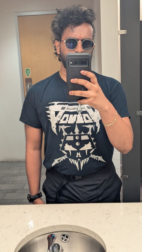 The tiara is almost completely invisible due to my curly hair. I'm wearing a Voivod T-shirt which isn't relevant to the post but it's important imo