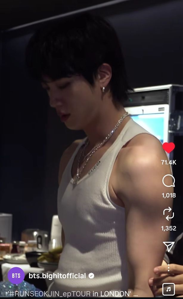 screenshot of run seokjin tour london behind the scenes. jin doing some kind of stretchy elastic exercise, arms out, tits poking through his little white singlet