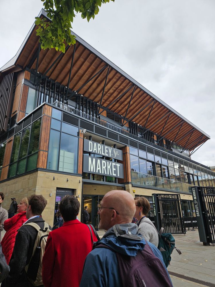 Darley Street Market's front entrance and a group of professionals on a tour of the newly (and beutifully) pedestrianised city centre.