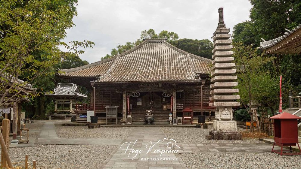 Hotsumisaki-ji, the 24th temple on the Shikoku Pilgrimage, is dramatically situated on Cape Muroto, where it is constantly exposed to the mighty Pacific Ocean. Its profound significance comes from its history as the site where Kūkai (Kōbō Daishi) is believed to have attained enlightenment through intense meditation in a seaside cave. The temple's atmosphere is one of raw, elemental power, distinct from more sheltered sites. A key, lesser-known feature is the steep path leading down to that very meditation grotto, allowing pilgrims to directly connect with the intense austerities that founded the pilgrimage tradition.