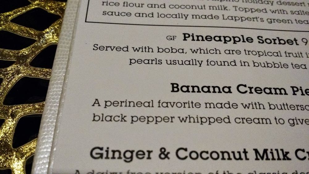 Photo of a menu that describes their banana cream pie as a "perineal favorite."