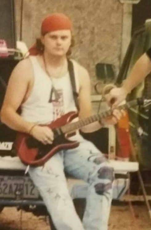 Idiot playing guitar