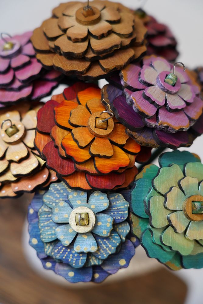 Close up in hand painted flower shaped spindles for making yarn 