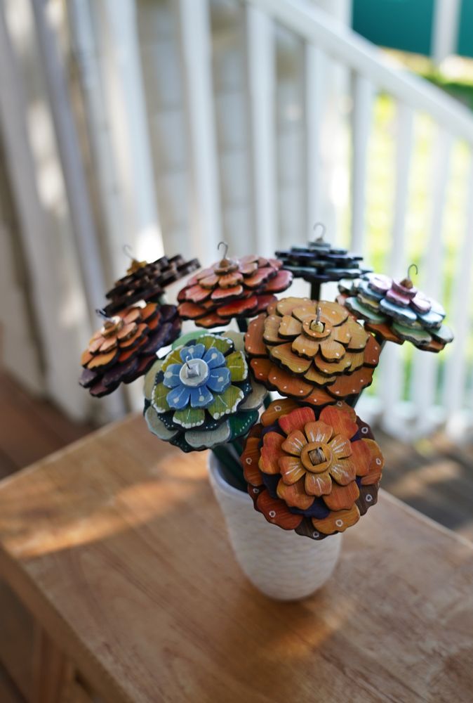 Floral handmade and hand painted rosy posy top whorl spindles in a vase