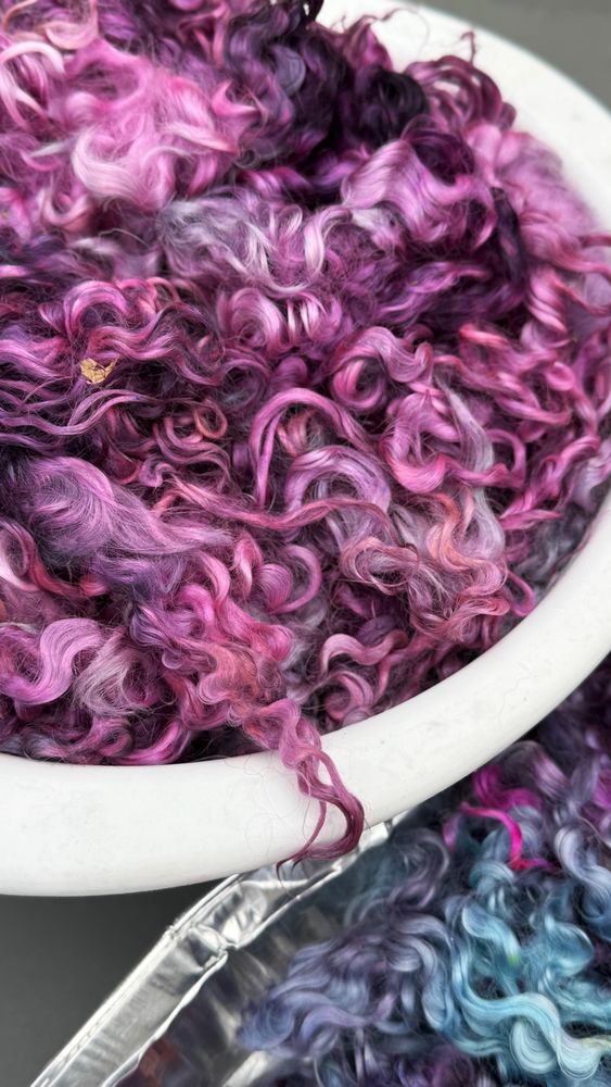 Teeswater x Leicester long locks dyed in shades of pink, purple, brown, blue, and touches of orange