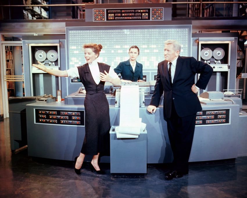 Katharine Hepburn & Spencer Tracy in front of the EMMY Computer from the film Desk Set (1957) Directed by Walter Lang