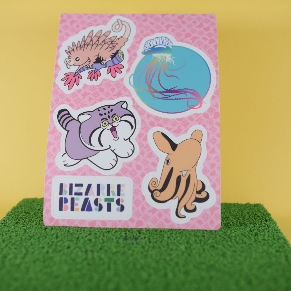 The Bizarre Beasts Season Zero pin designs as a sticker sheet. Featuring the man o war jellyfish, prehensile-tailed porcupine, pallas's cat, and dumbo octopus, and a bizarre beasts logo. 