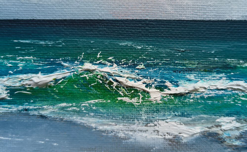A wave breaks over itself, seascape in aqua palette, crop of original picture