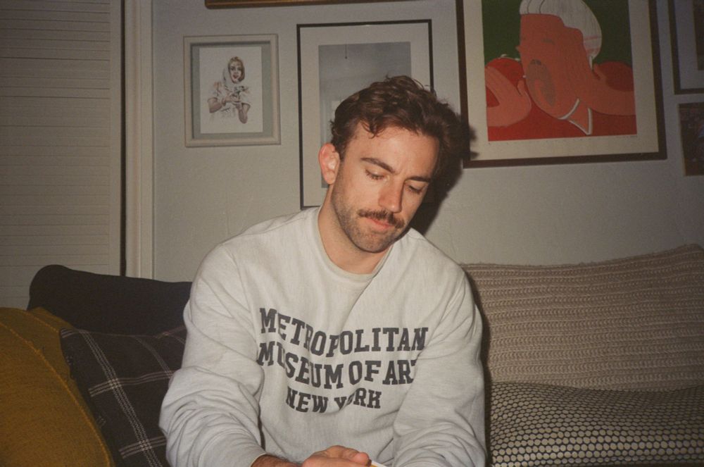 Christian in a sweater that says Metropolitan Museom of Art New York