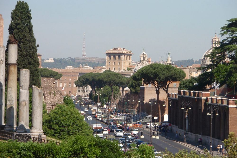 View of Via dei Fori Imperiali in Rome, with traffic.