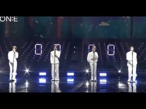 BTS performing “00:00 (Zero O’Clock)” during Bang Bang Con 2020, standing in soft stage lighting with calm expressions. The mood is gentle and reflective.