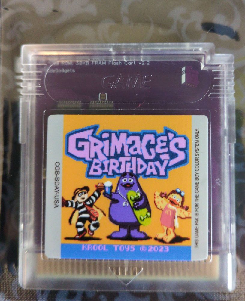 A gameboy cartridge for Grimace's Birthday.