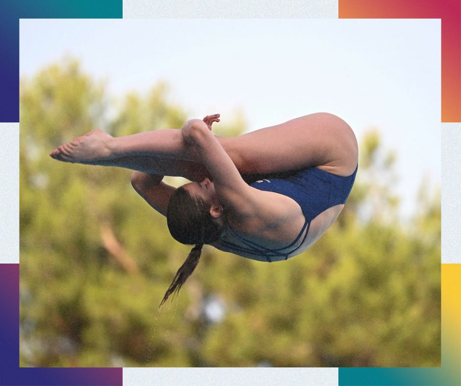 A photo of Amy mid-dive in an impressive back tuck position.