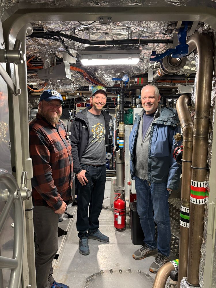 Our team in the engine room of the Tara Polar Station