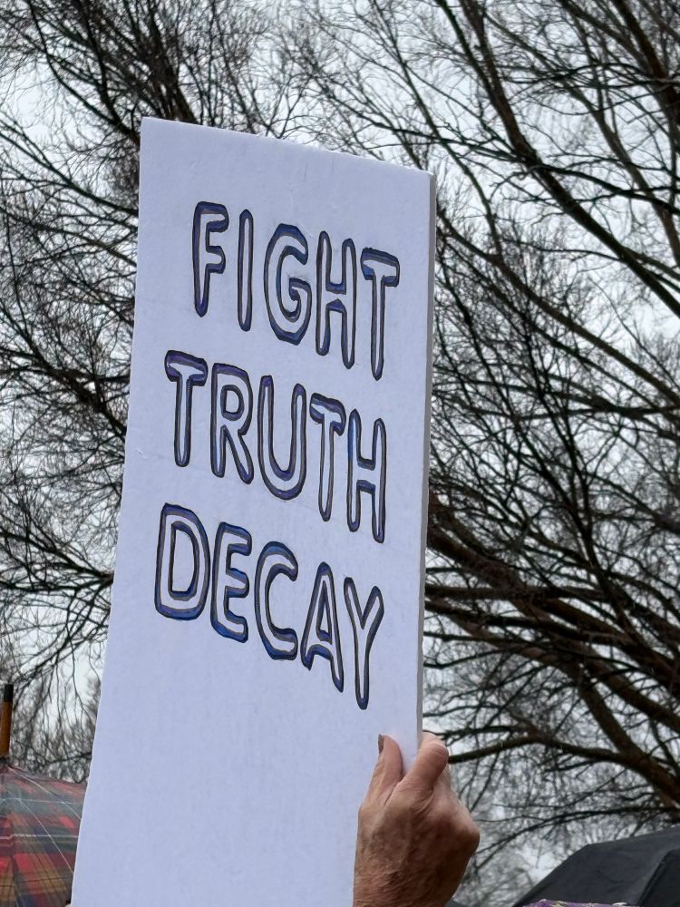 protest sign - fight truth decay
