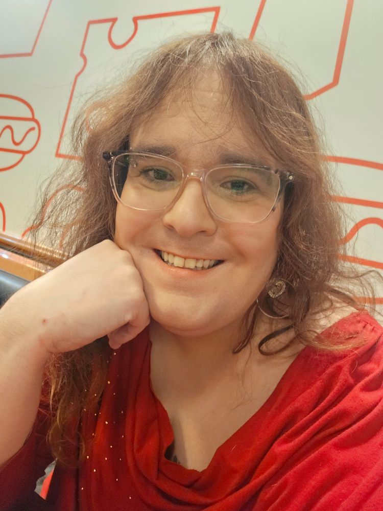 Me with my new glasses in a red shirt