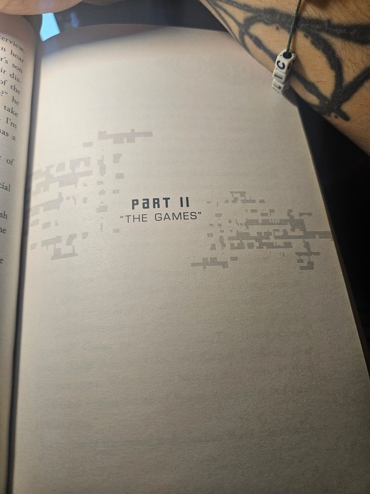 Right page of a book, in the middle , it reads "Part II 'The Games'