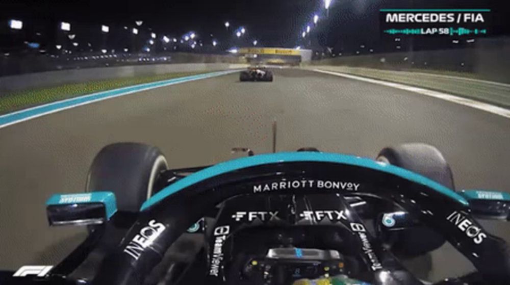 a mercedes / fia race car is on a track at night