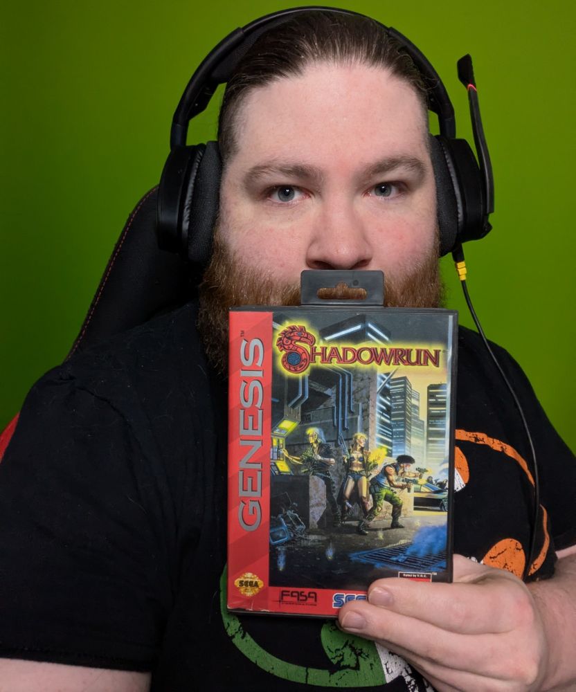 Maskofgames holding a Genesis copy of Shadowrun.