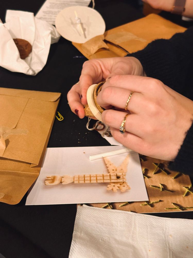 Hands crafted a ring from cork and card