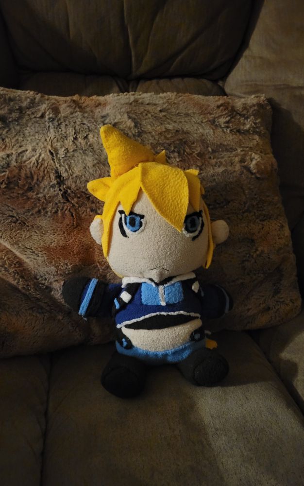 An image of a homemade Gunvolt plushie sitting on a chair.