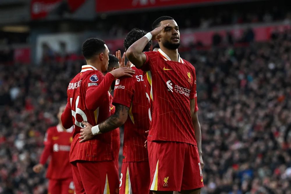 Cody Gakpo salutes the Anfield crowd after his second goal of the day against Ipswich Town.
