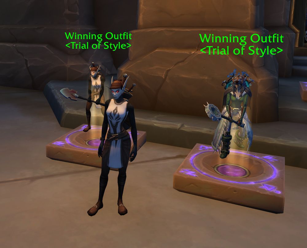 World of Warcraft Screenshot. Player standing next to a mannequin both wearing the same outfit.

The outfit: Dark trousers, brown shoes, a white tabbard with a black pattern, brown hat and a shovel in hand.

There's a second mannequin wearing winter attire.
