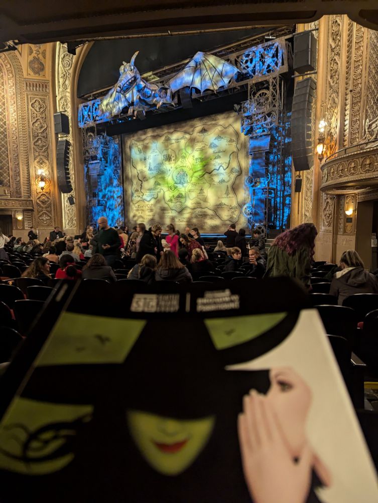 Wicked stage, pre-show with program in foreground. 