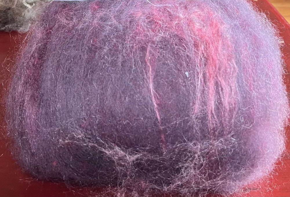 Photo of Polwaeth, possim and ailk batt in pink and pale mauve.