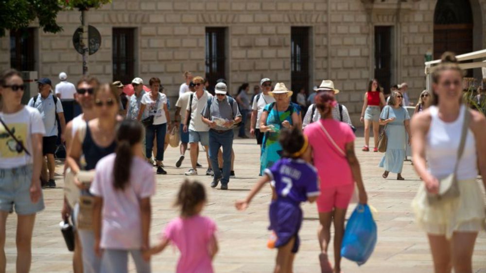 ‘Do not be conspicuous’: Spanish city billboards urge British tourists to keep their clothes on and behave | CNN