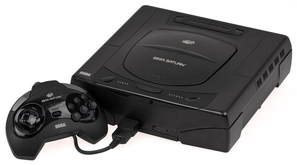 a Sega Saturn console with a controller.
