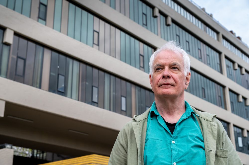 David Gedge stood outside the Roger Stevens Building on University of Leeds campus