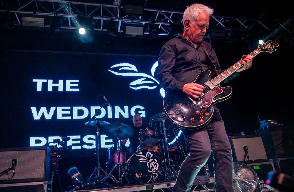 David Gedge plays guitar on stage