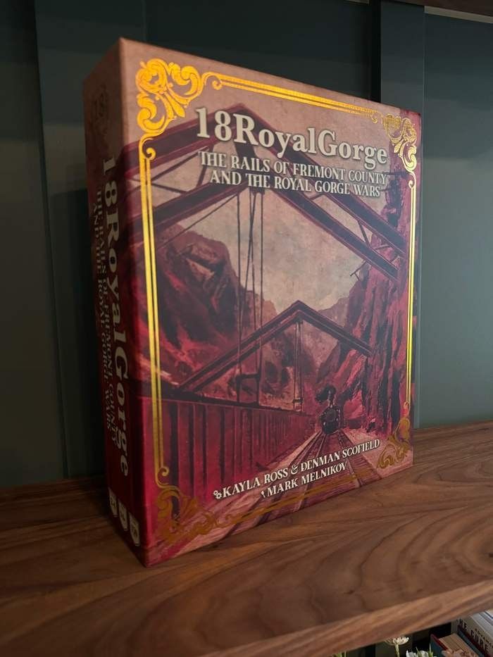 A game box with a bridge on the cover and the title 18 royal gorge