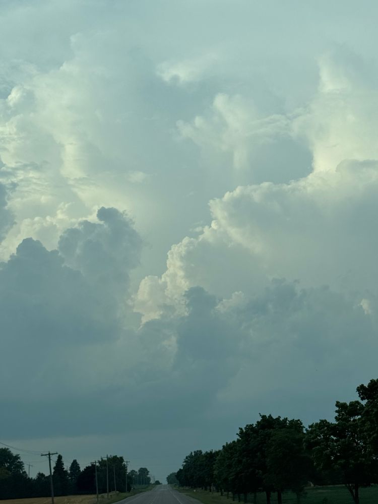 Big fluffy clouds in the western sky near Crediton Ontario on the evening of July 24, 2025