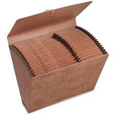 An open humble, brown, A-Z accordion file folder with a string tie. It awaits your reference files 