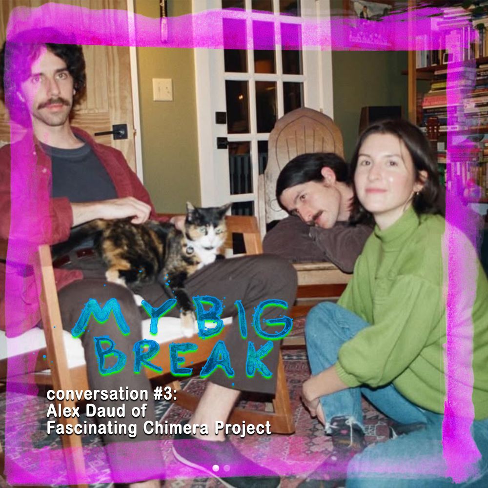 the band fascinating chimera project sits around a very cute calico cat - Alex Daud, the subject of the interview, sits on the floor to the right of the frame